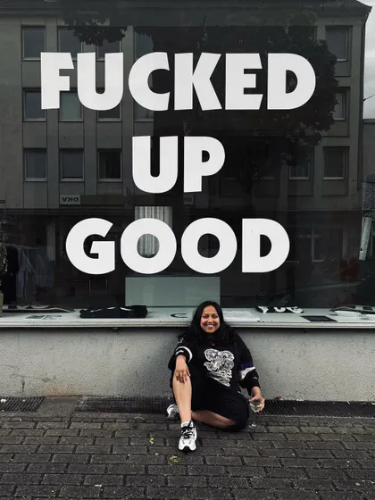 A moment of reflection in Germany. The phrase on the window, "Fucked Up Good," perfectly captured the beautiful chaos of the tour.