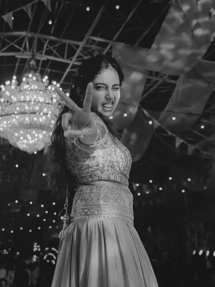 A fun, candid black and white shot from a live performance. It's all about having a good time on stage.