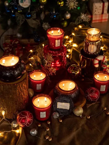Make spirits bright, joyful, and merry this holiday season. Our collection of red and black candles, set amongst festive ornaments, is perfect for creating a dramatic and celebratory display.