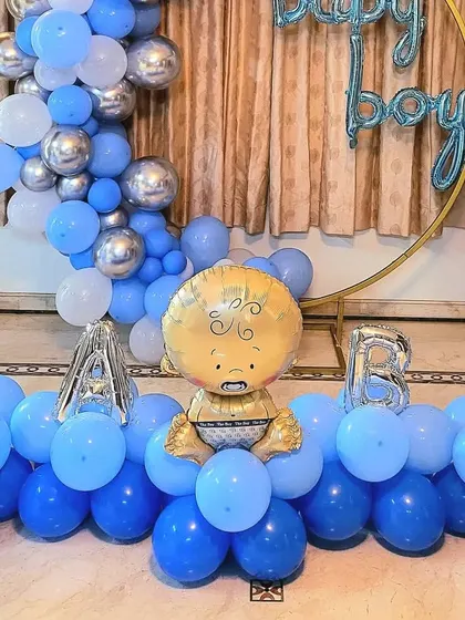 A detailed shot of the "BABY" letter balloons and foil character.