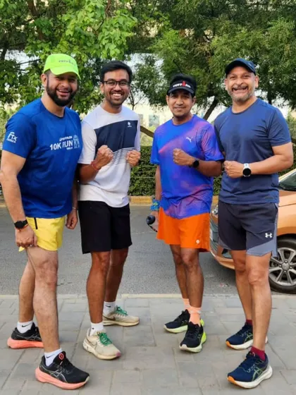 Four of our runners, a picture of strength and camaraderie. We train as a team and support each other's goals.