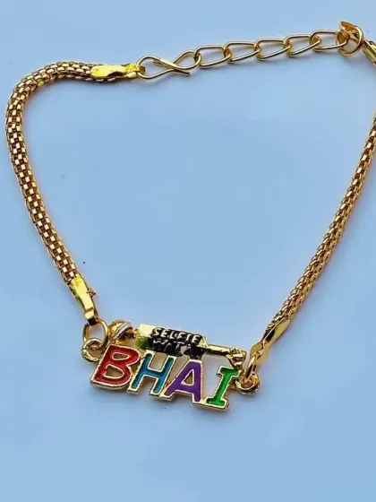 This "BHAI" rakhi features vibrant, multicolored letters and a unique gun-shaped charm for a bit of extra personality.