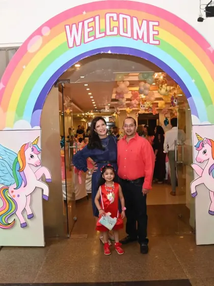 A magical Unicorn-themed entrance for Meera's 4th birthday. The rainbow arch and unicorn cutouts make for a perfect welcome and a great spot for family photos.
