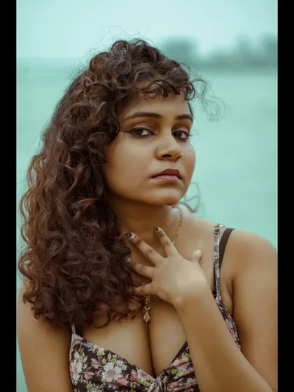 A close-up portrait with a direct, intense gaze. This kind of shot is powerful for a portfolio, showcasing the model's ability to convey emotion with just their eyes.