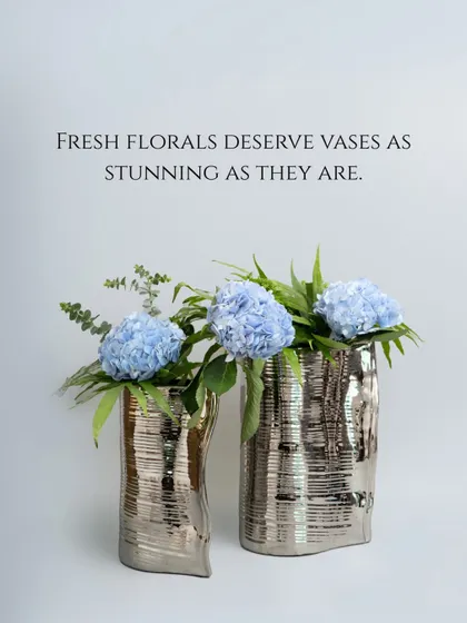 Fresh florals deserve vases as stunning as they are. These metallic, textured vases have an irregular, organic shape that adds a touch of glamour and reflects light beautifully.