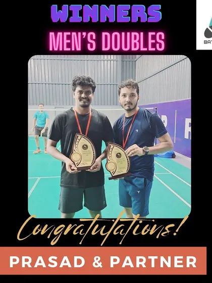 I'm proud to see my students succeed. Here's Prasad and his partner after winning the Men's Doubles category, a testament to their hard work and the effectiveness of our training regimen.