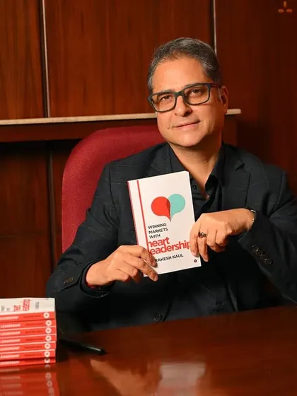 An author's portrait taken during his book launch. Holding the book connects the author to his work, creating a perfect promotional image for press kits and social media.
