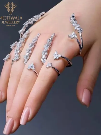 Redefining adornment with avant-garde design. These articulated diamond nail rings are a bold expression of individuality, crafted with marquise and pear-shaped diamonds that trace the form of the fingers. This is where our innovative spirit meets high jewellery craftsmanship.