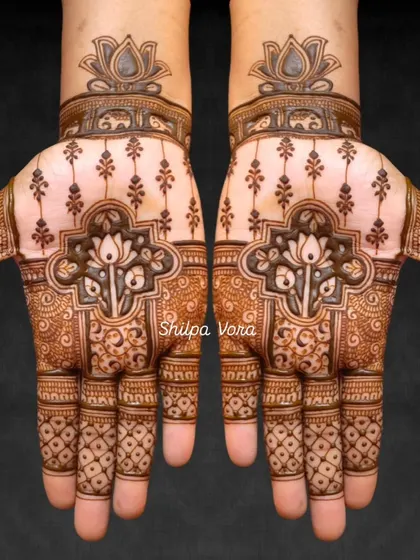A symmetrical design with a central lotus motif set in a modern, geometric frame.