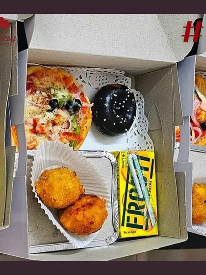 A look inside one of my customized snack boxes for a birthday girl. This one includes a mini pizza, cheese corn balls, a mini donut, and a juice box.