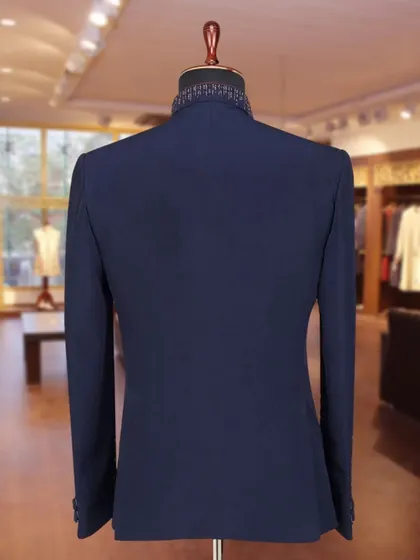 The back view of the navy Jodhpuri, showing the detailed embroidery on the collar.