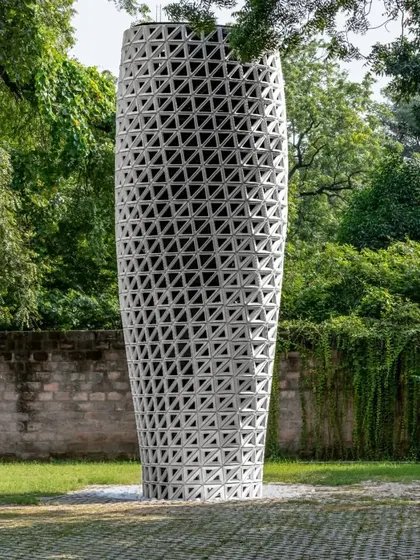 The VERTO prototype, installed in New Delhi's Sunder Nursery Park, stands as a functional sculpture. Its twisting form and perforated skin are the result of CFD analysis to optimize airflow and purification effectiveness.