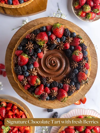 My Signature Chocolate Tart with fresh berries, decorated with star anise for a festive touch. The combination of sweet berries and rich chocolate is simply irresistible.