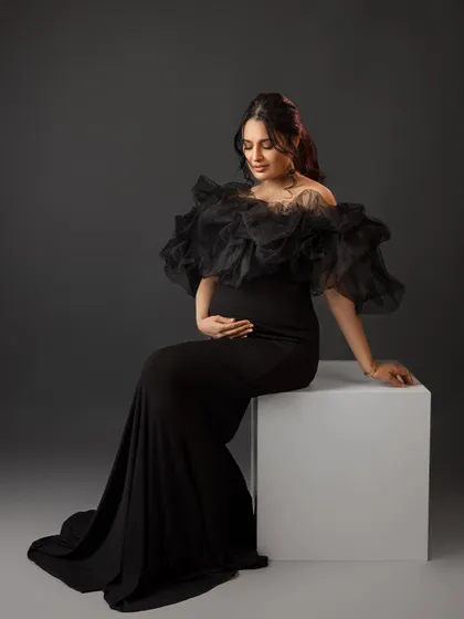 A regal seated portrait, exuding grace and elegance.