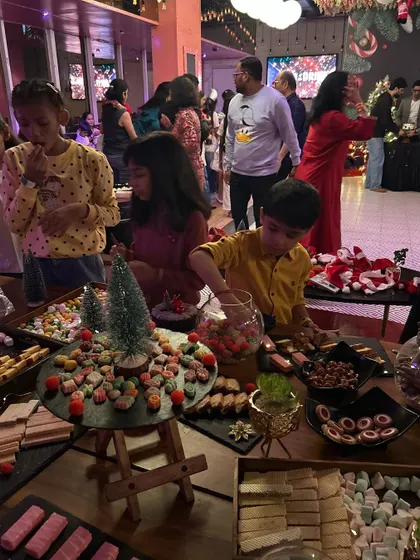 Kids enjoying the candy grazing table. This is pure joy. These tables are an amazing centerpiece and a guaranteed way to make any kid's party a massive hit.