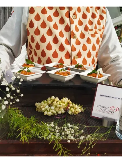 A tray of our signature Tandoori Prawns, beautifully arranged and garnished, ready to be served to guests.