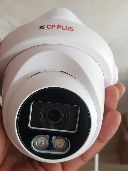 A close-up of a CP Plus turret dome camera, which offers day and night color vision.