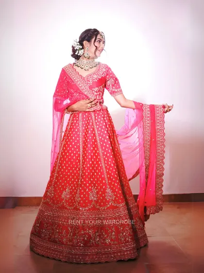 Another full-length shot of the pink lehenga, showing its beautiful drape and embroidery.