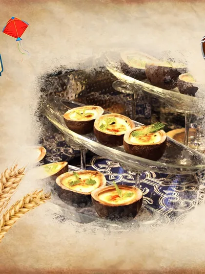 A Baisakhi special. These mini tartlets are filled with a savory mixture and presented on a tiered glass stand, reflecting the festive spirit of the Punjabi harvest festival.