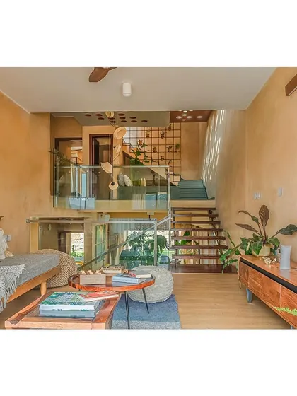A view of the split-level family lounge. This design creates distinct yet connected living zones, adding vertical interest and a dynamic quality to the interior.