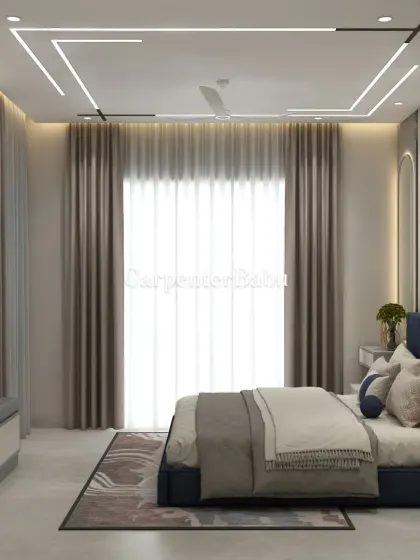 A master bedroom with a deep blue bed and a headboard wall featuring abstract art. The false ceiling has a unique linear lighting pattern, adding a modern, graphic element.