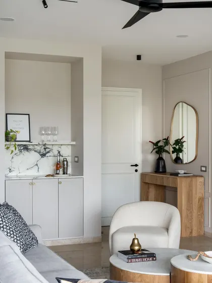 A compact living area from 2023, featuring a built-in bar nook. This shows how we can incorporate luxury details even in smaller spaces.