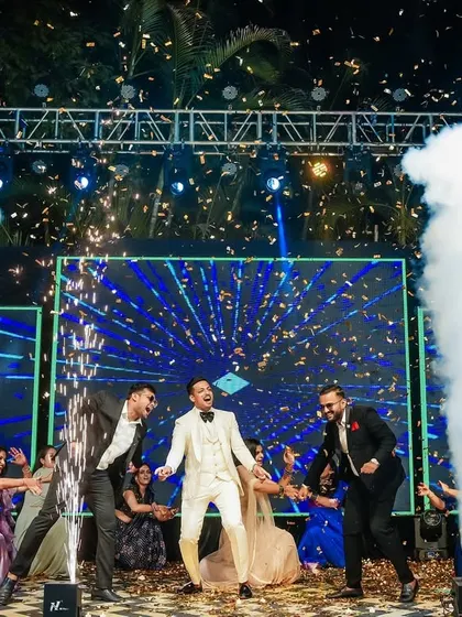 The groom's high-energy dance performance with his friends, complete with stage effects.