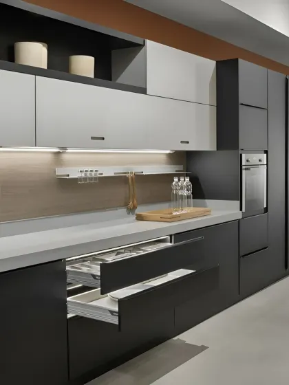 See the beauty of smart storage in this modern kitchen. The deep drawers with built-in organizers and sleek, handleless design in a dark matte finish demonstrate how I prioritize both aesthetics and functionality in my kitchen interior projects.