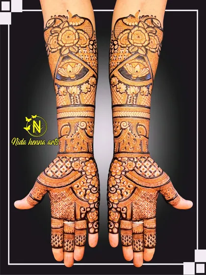 This is a classic, full-coverage Indian bridal design. It shows how I use traditional motifs like florals, lotuses, and intricate jaal patterns to create a rich, dense look that extends up the arms for a truly royal feel.