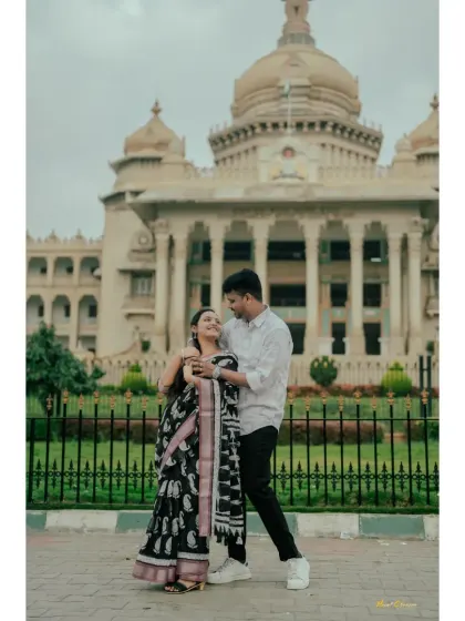 A couple poses in front of the Vidhana Soudha, capturing a classic and elegant urban pre-wedding portrait.
