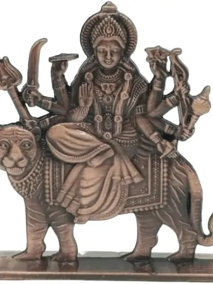 A metal idol of Durga Maa on her lion, providing a sense of protection.