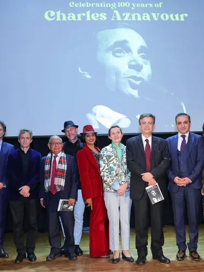 A group photo of the organizers, performers, and special guests at the Charles Aznavour tribute. This image showcases the collaborative spirit behind our successful events.