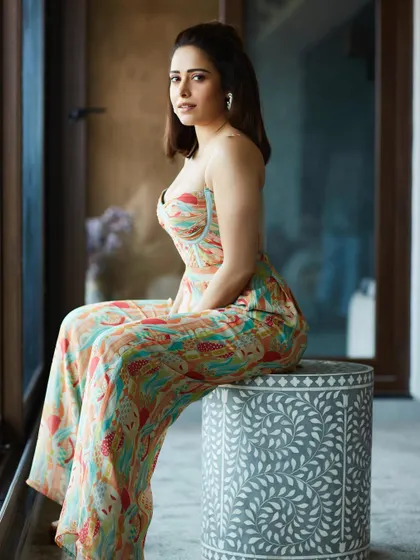 This printed bustier jumpsuit is a versatile piece I chose for Nushrratt Bharuccha's promotions. It's stylish, comfortable, and perfect for a long day of interviews and appearances.