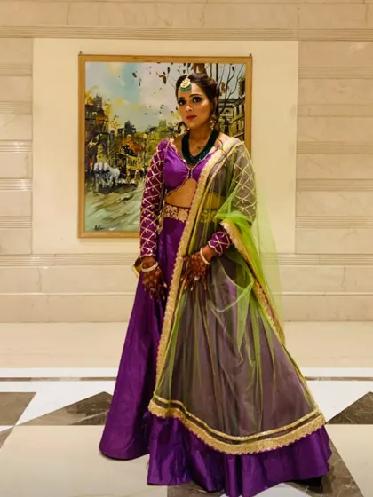 A full view of my bridesmaid look. The vibrant purple and lime green color combination is a bold choice that stands out in a crowd, proving that bridesmaids can have fun with their fashion choices.