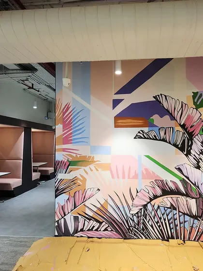 A beautiful abstract botanical mural for the JLL office in Gurgaon. The pastel color palette and combination of geometric shapes and leaf patterns create a soft yet modern aesthetic.