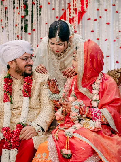 Another beautiful moment of family interaction, as a guest shares a blessing or a lighthearted word with the couple.