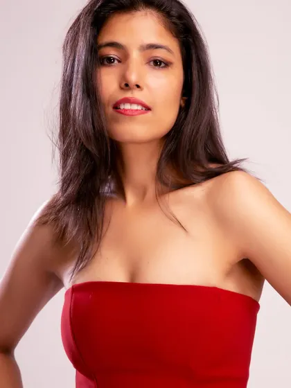 A close-up beauty shot in the red dress, highlighting my features and suitability for campaigns that require a strong facial presence.