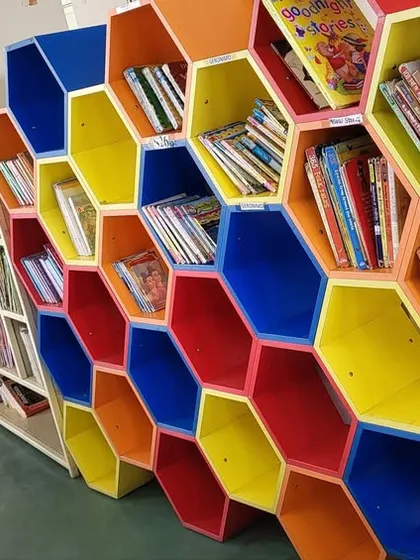 The beautiful, colorful honeycomb bookshelves at Capstone School. It was a joy to visit their library during their LitFest.
