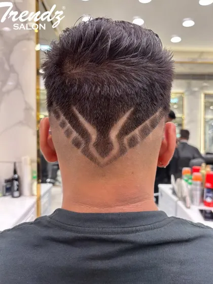 A bold and creative hair design for men. This geometric pattern on the back is a great way to express personal style.