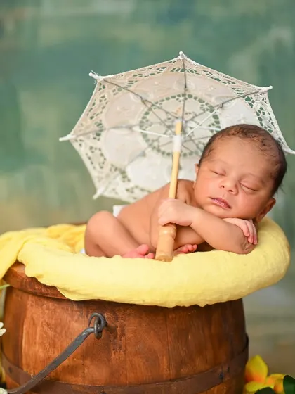 A duplicate of image 31, a cheerful and vibrant newborn portrait.