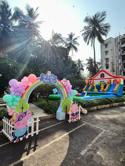A Peppa Pig-themed 'Aqua Park' entrance, leading to a fun-filled area with inflatables and water games.
