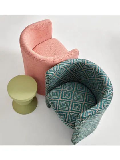 The 'Toshka' collection of fabrics can breathe new life into any piece of furniture. Here, a plain and a patterned fabric from the same collection are used on contemporary chairs, showing how to mix and match within a colour story.
