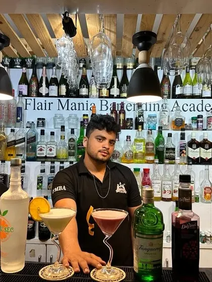 A selection of gin-based cocktails, from a classic martini to a colorful sour, showing our versatility.