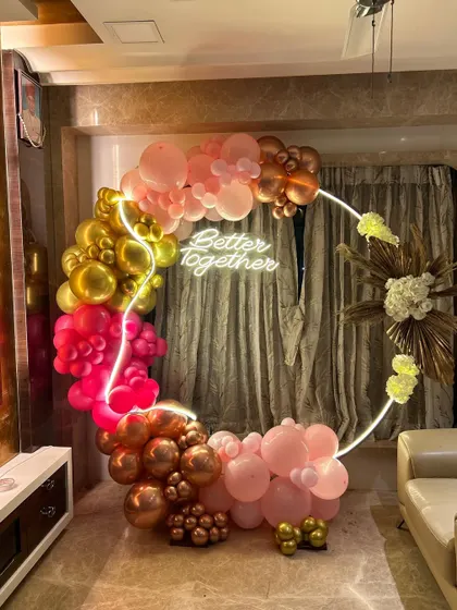 This wider shot shows how our balloon ring decor can transform a corner of a living room into a festive and photo-worthy spot for any celebration.