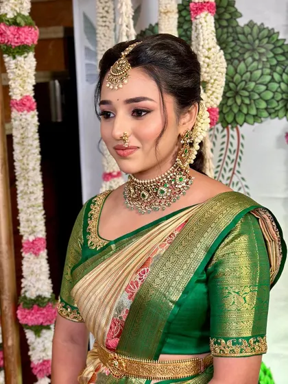 Nischaya's side profile, highlighting her traditional jewelry and the perfect harmony of her look.