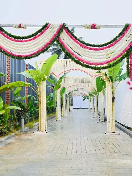 Another perspective of the beautiful floral entrance tunnel, showcasing the continuous arches that create a sense of depth and grandeur for arriving guests.