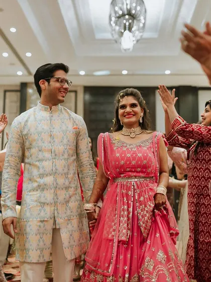 A beautiful candid moment capturing the way the groom looks at his bride during their Haldi ceremony.