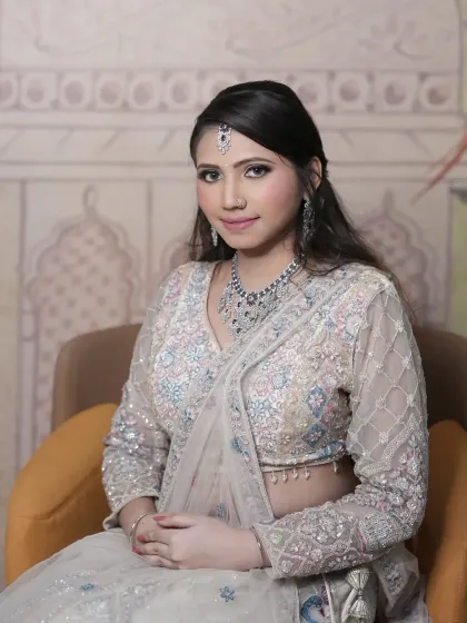 Another beautiful portrait in the multi-color pastel lehenga, paired with a diamond and sapphire necklace set.