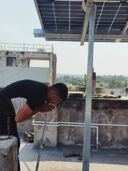 A customer performs a small puja ceremony for his new solar installation, a tradition we are honored to witness.
