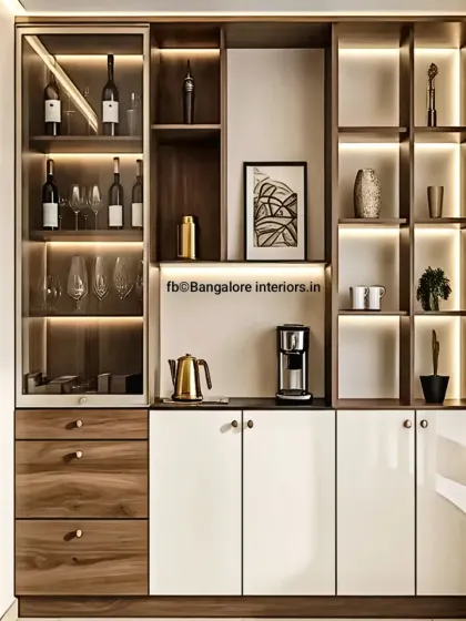 A sophisticated crockery and bar cabinet perfect for modern dining areas. This unit features a mix of wood-grain drawers, glossy white cabinets, and glass-fronted display sections with integrated lighting, plus a dedicated coffee station counter.
